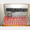 8AT-9940-00 aircraft pipeline plug set open fitted storage case showing the complete arranged set of red pipeline plugs and original technical instruction plates