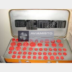 8AT-9940-00 aircraft pipeline plug set open fitted storage case showing the complete arranged set of red pipeline plugs and original technical instruction plates